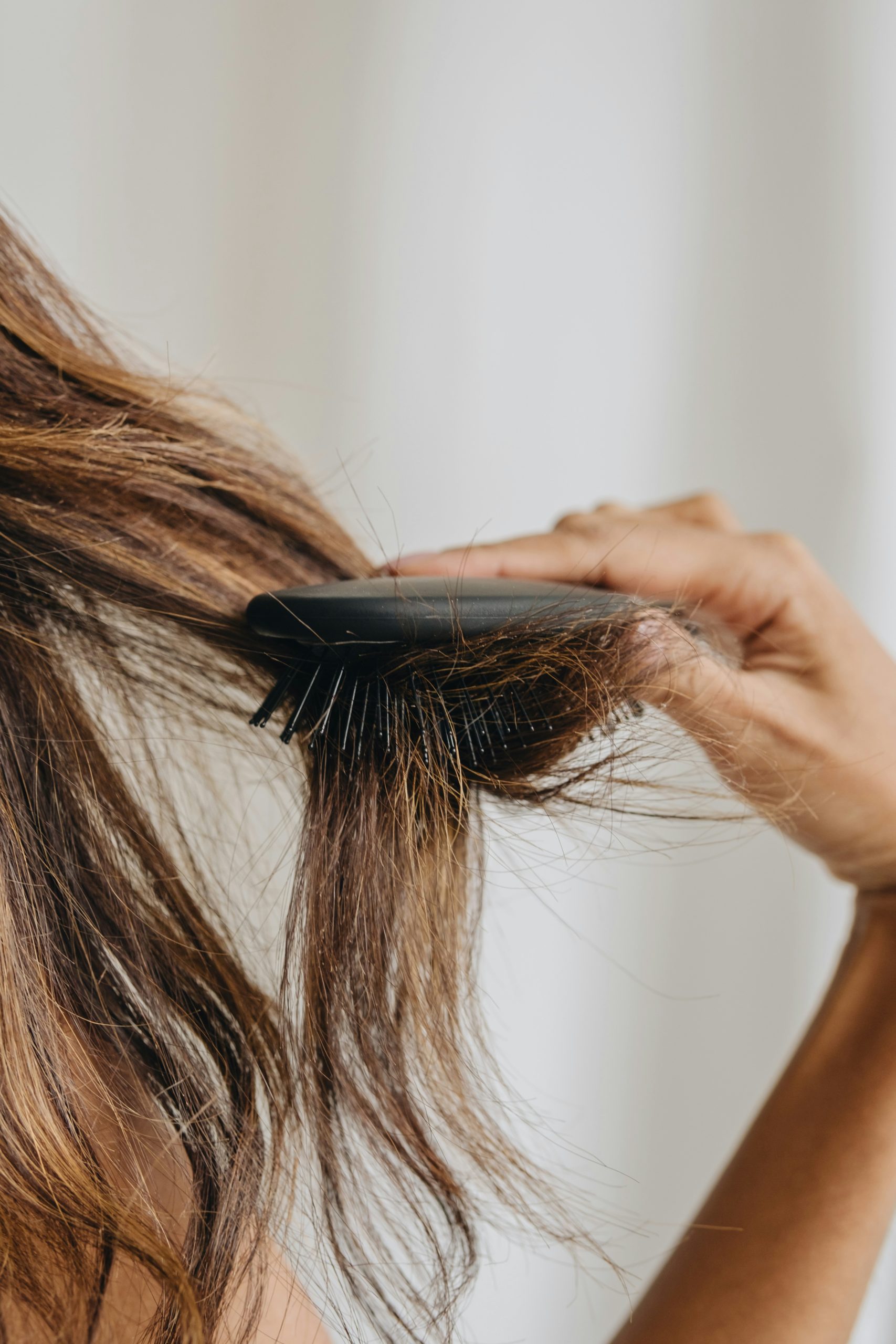 woman brushing her hair