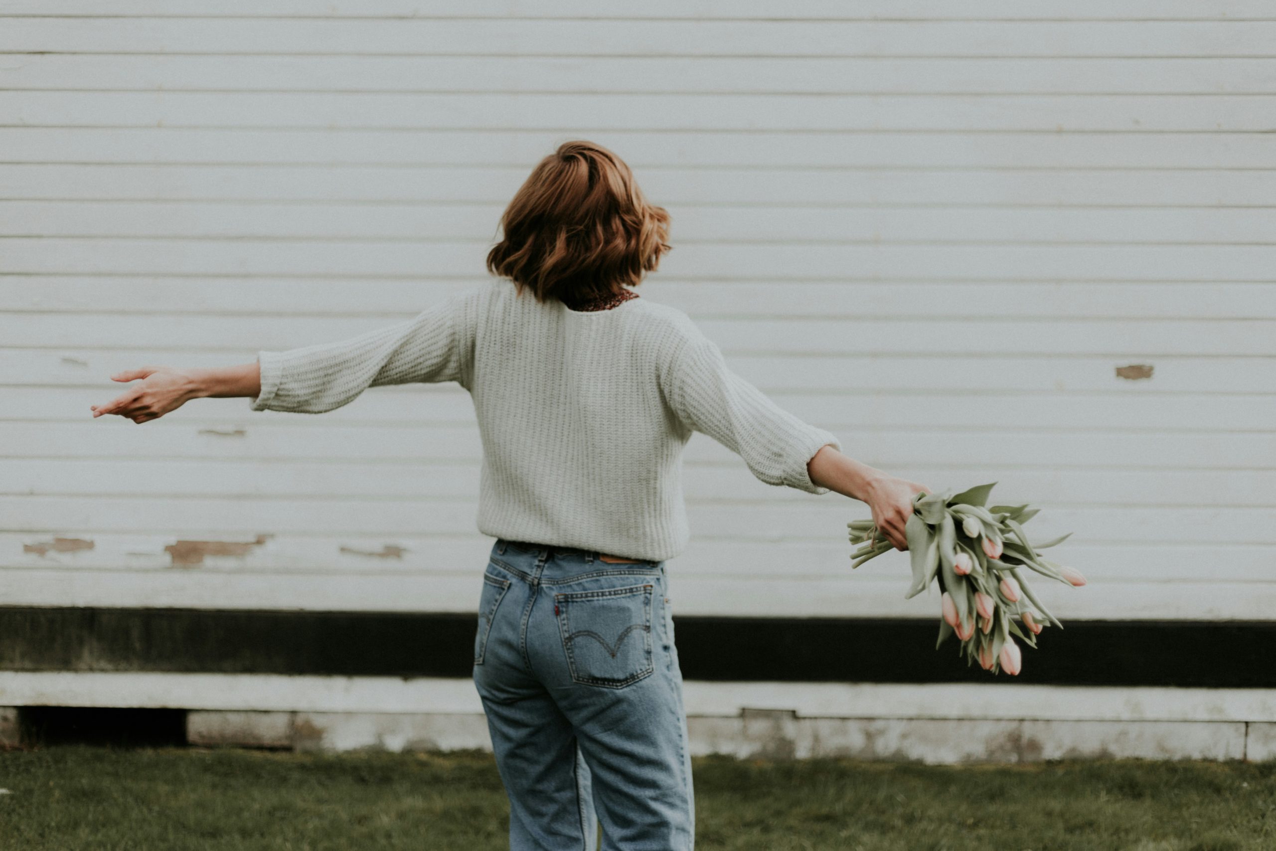 woman with arms out