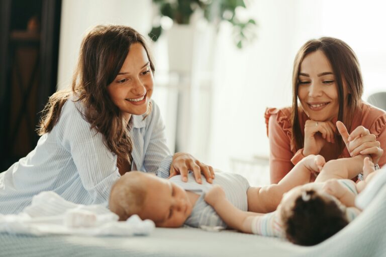 two new moms with their babies